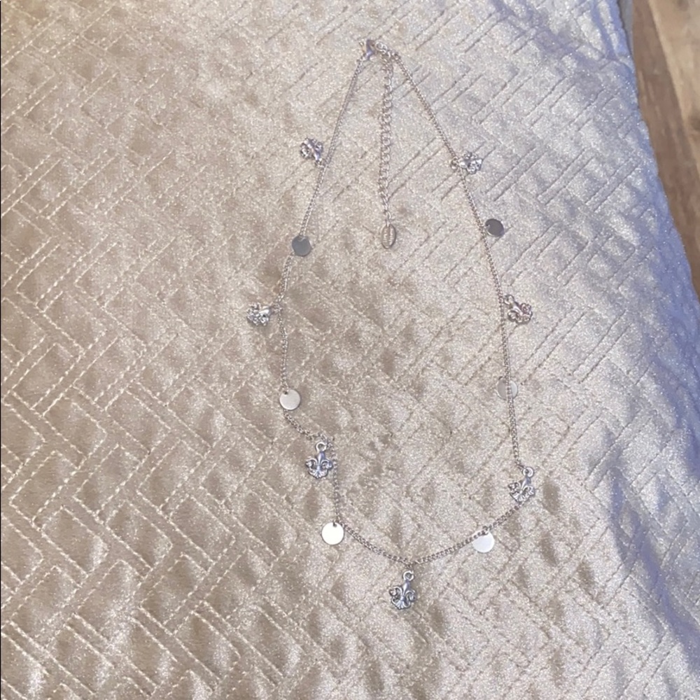 Marlyn Schiff- delicate fleur-de-lis necklace